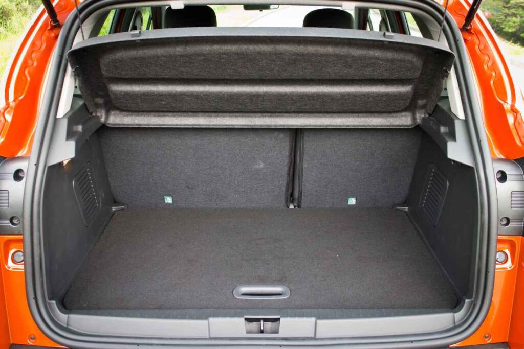 empty hatchback of red car with gray interior