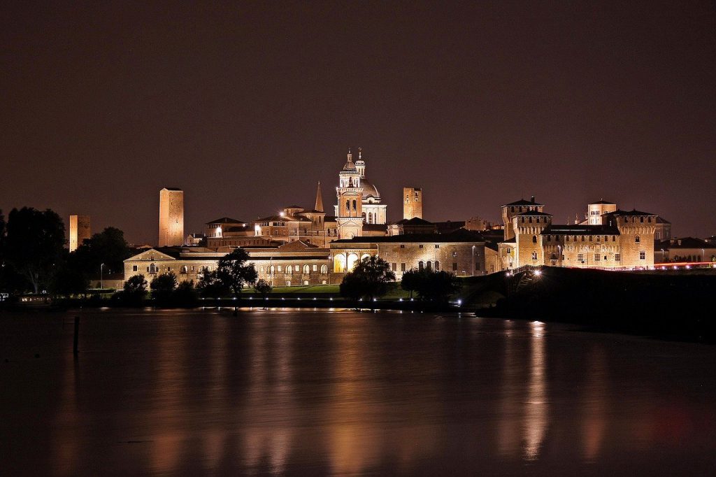 stone castle and buildings of mantova at night