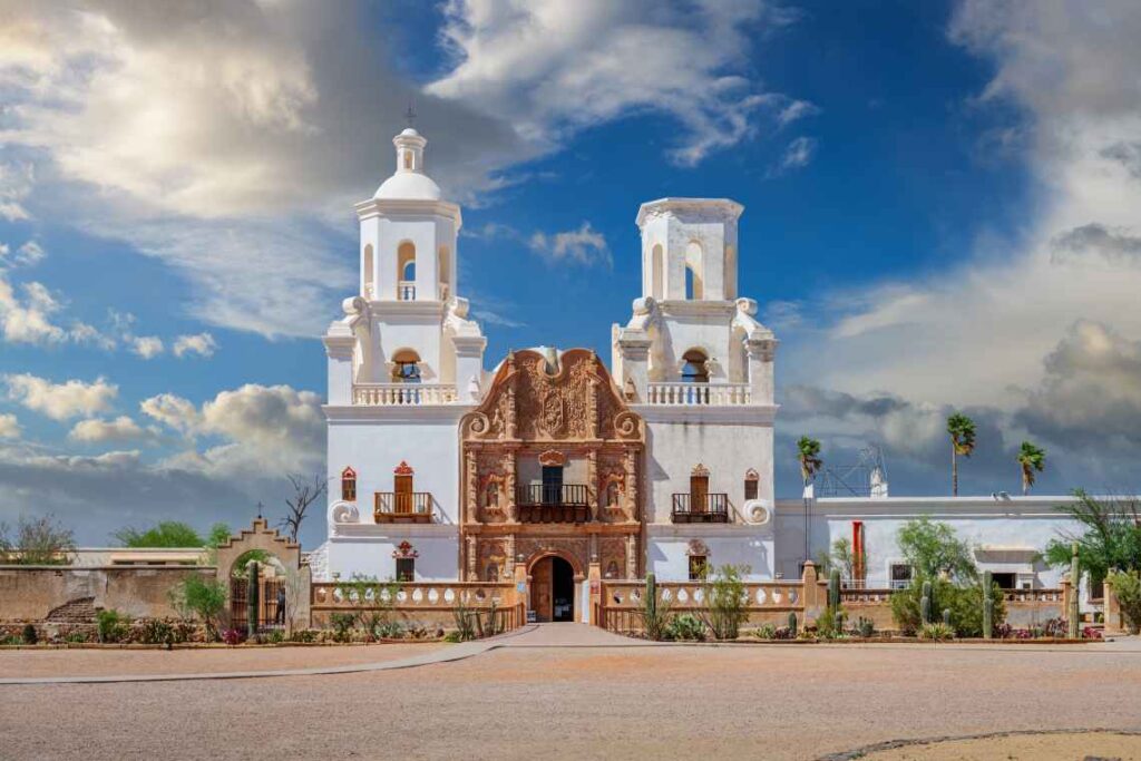 the spanish style white and tan san xavier del bac mission in tucson arizona