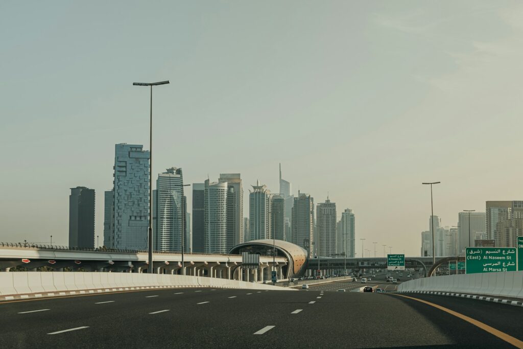 Highway with a view of Dubai’s modern skyline and contemporary skyscrapers.
