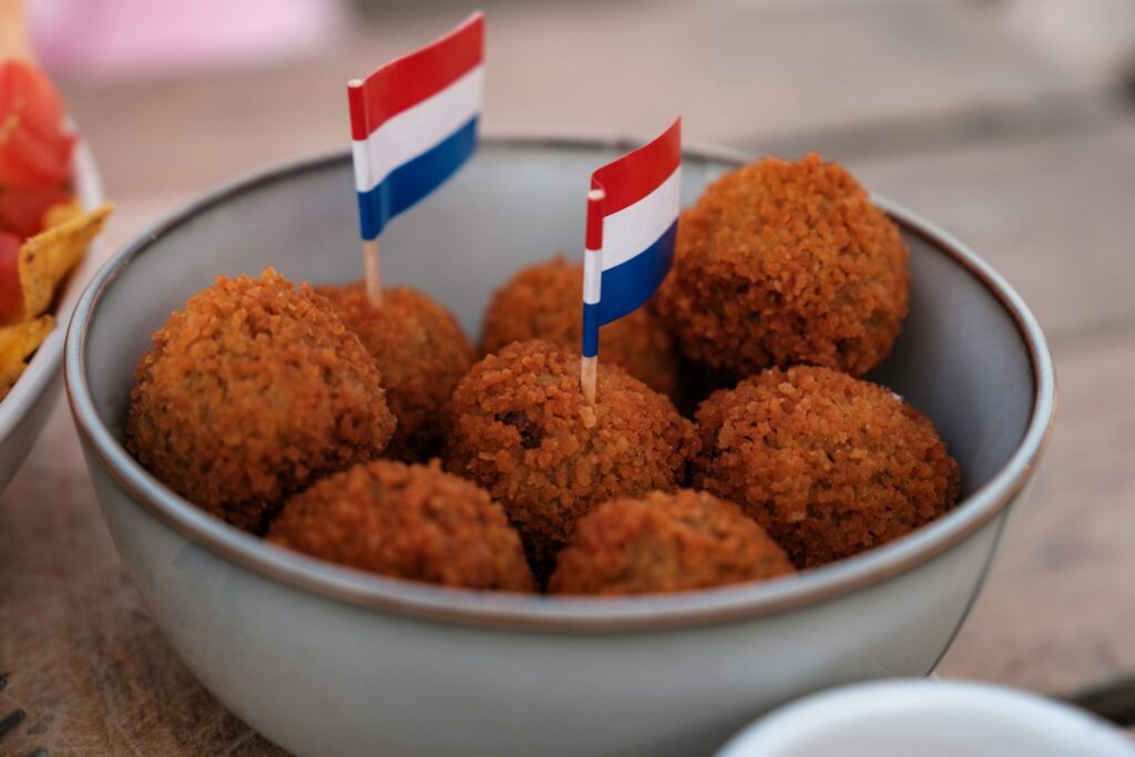 A bowl of food with a Dutch flag sticking out of it.