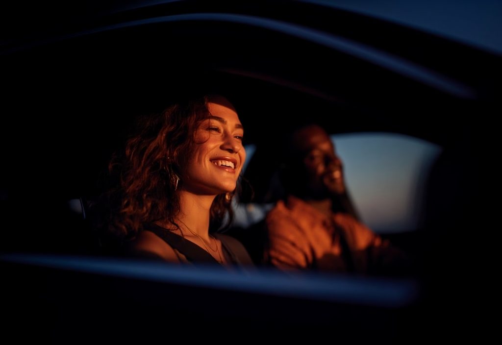 SIXT Loyalty program, two people smiling in the car
